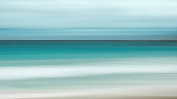 istock Empty sea and beach background with copy space, Long exposure, blur motion blue abstract vintage tinted gradient background 1073852316