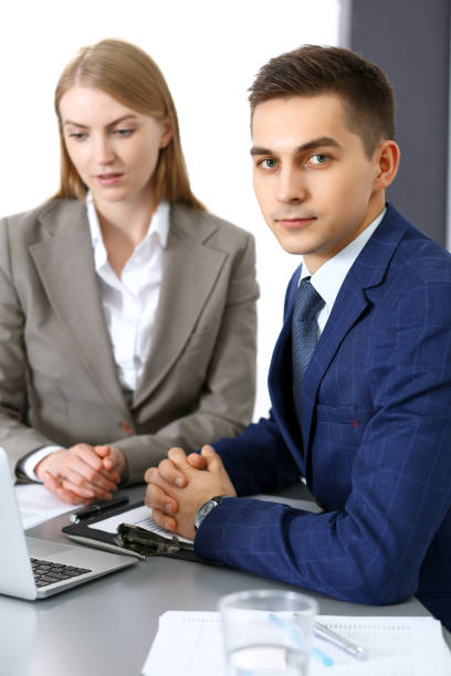 istock Business people using laptop pc while discussing project in office. Successful meeting and negotiation concepts 1073853726