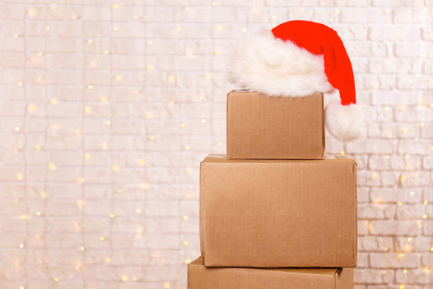 istock Corrugated fiberboard boxes with christmas lights on background. 1073866962