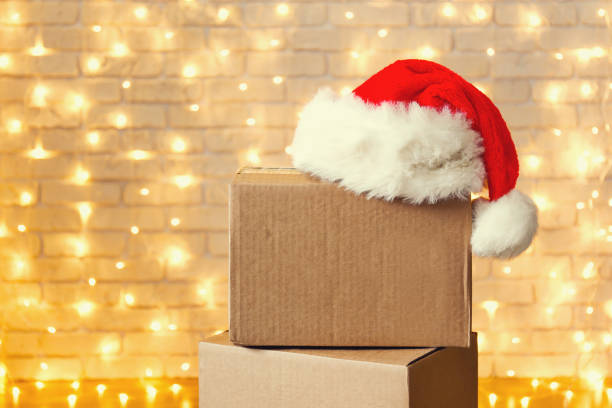 istock Corrugated fiberboard boxes with christmas lights on background. 1073867308