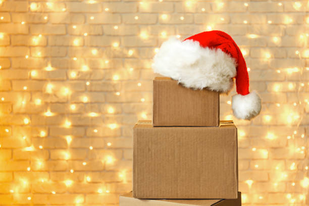istock Corrugated fiberboard boxes with christmas lights on background. 1073867318