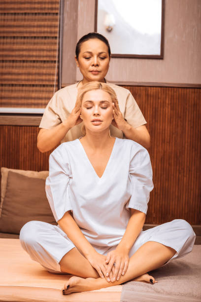 istock Nice attractive woman having a head massage 1073882632