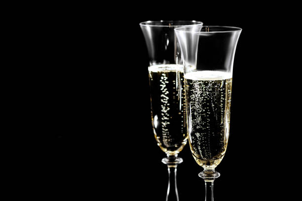 istock Glasses of champagne with splash 1073899528