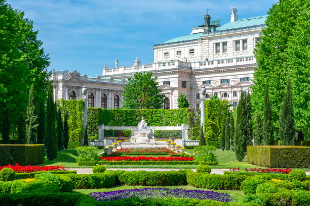 Volksgarten park and Burg theatre, Vienna, Austria Vienna, Austria - April 2018: Volksgarten park and Burg theatre in center of Vienna burgtheater vienna stock pictures, royalty-free photos & images