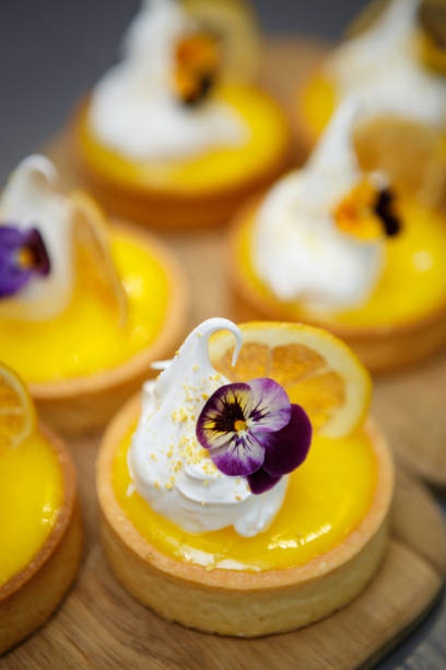 istock Biscuit cupcakes with dryed lemon slice and cream 1073904004