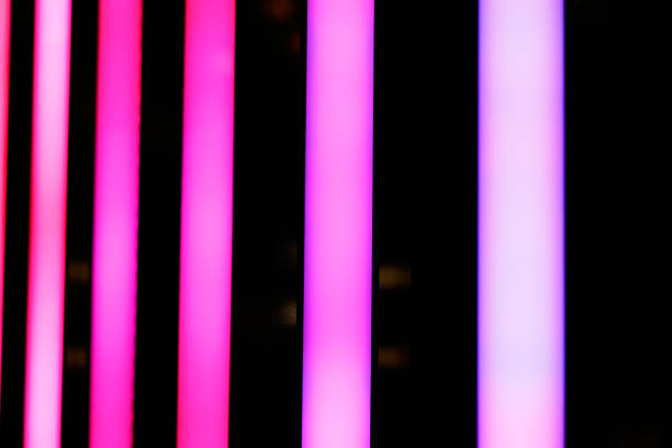 istock Neon pink shiny lines abstract background. 1073915104