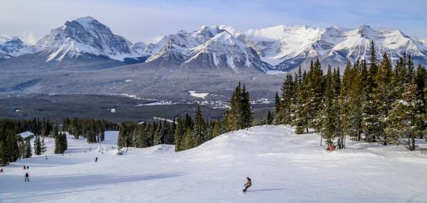 istock Downhill skiing and snowboarding in Lake Louise, Alberta, Canada 1073915652