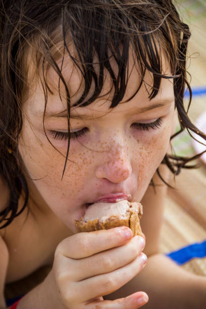 istock little girl eat ice-cream 1073919426