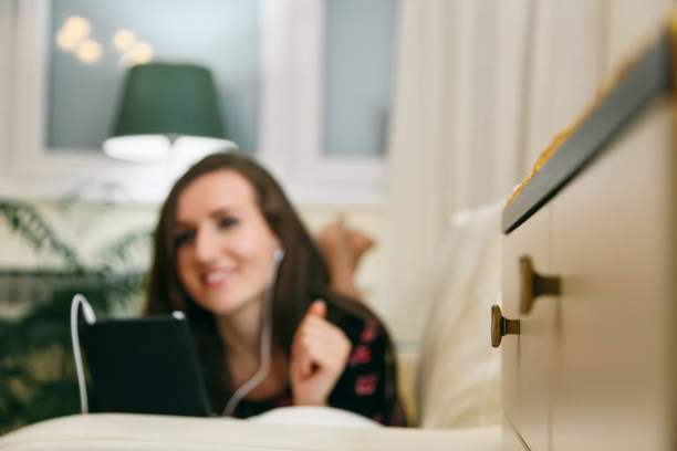 istock Woman relaxing at home with a digital tablet 1073919888