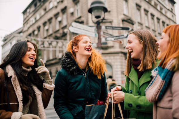 istock Smiling woman with friends 1073924344