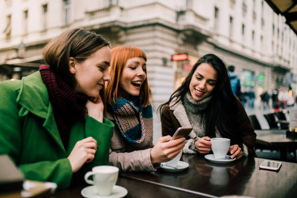istock Girls looking at mobile phone 1073928526