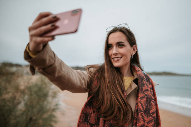 istock Young woman taking her selfie 1073933130