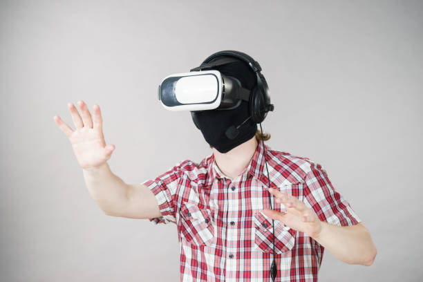 istock Gamer man wearing VR 1073933996