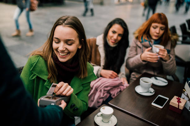 istock Girl paying with credit card 1073934320