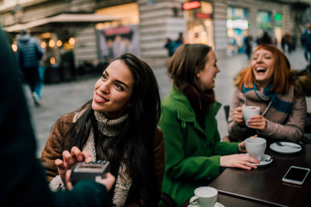 istock Joyful woman paying with credit card 1073939146