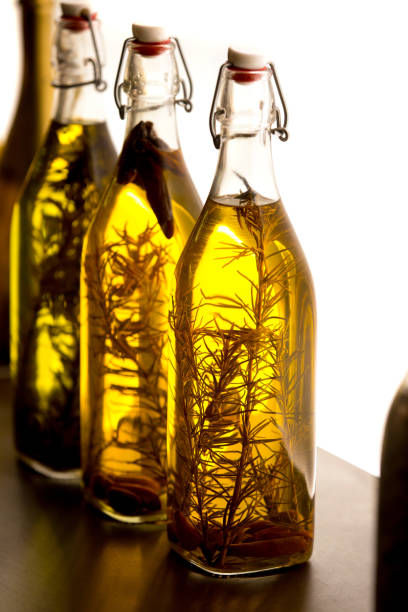 istock Bottles with oil and rosemary 1073949224