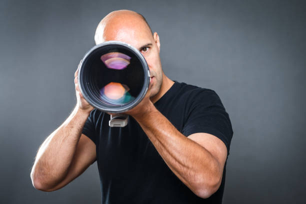 istock Young, pro male photographer in his studio 1073959368