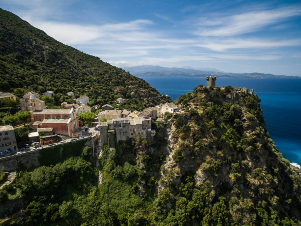 Aerial view of the beautiful village of Nonza, in Cap Corse, Aerial view of the beautiful village of Nonza, in Cap Corse, Corsica, France haute corse photos stock pictures, royalty-free photos & images
