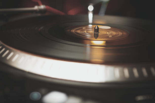 istock Vintage dj turn table with vinyl record disc in close up 1073965680