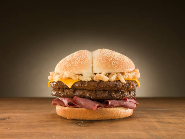 istock Double cheese burger on wooden table. 1073968714