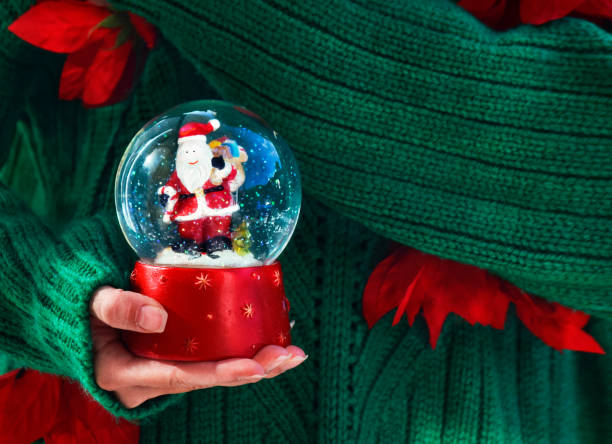 istock Girls holds Christmas snow globe 1073973278