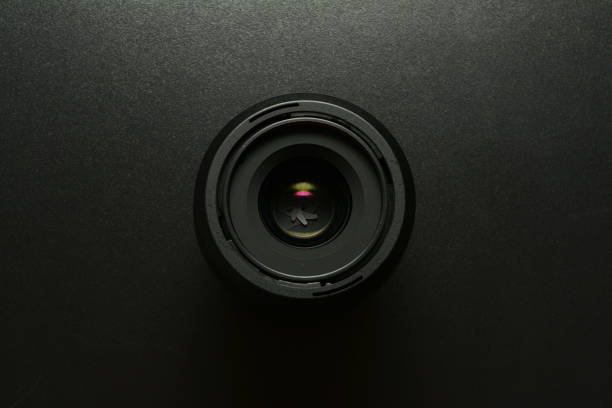 Close up of a camera lens, black background stock photo
