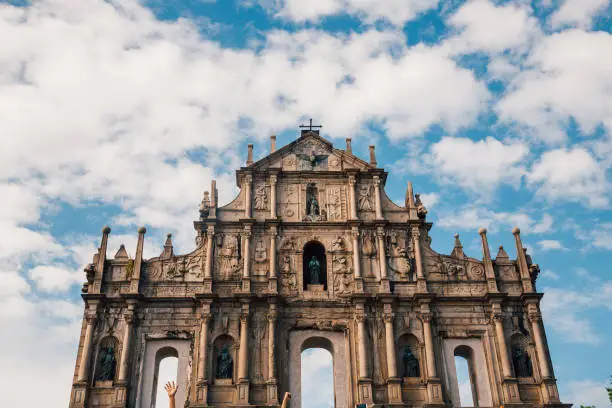 Macao/Macau, China - August 30, 2017: Ruins St.Paul Church with dramatic sun light, famous landmarks and world cultural heritage in centre of Macao/Macau, China