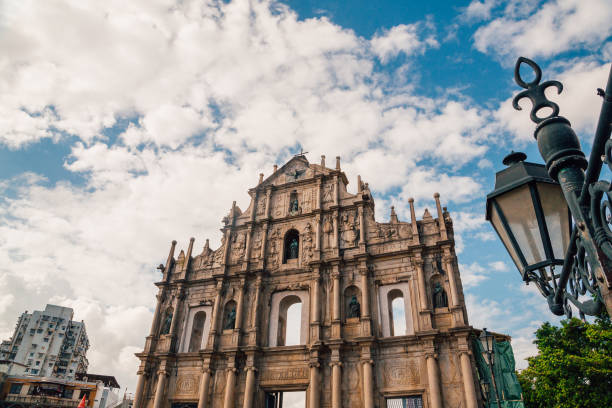 Ruins St.Paul Church with dramatic sun light Macao/Macau, China - August 30, 2017: Ruins St.Paul Church with dramatic sun light, famous landmarks and world cultural heritage in centre of Macao/Macau, China macao photos stock pictures, royalty-free photos & images