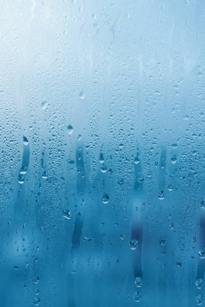 window glass with high air humidity, large drops drip. background of natural water condensation - condensation steam window glass imagens e fotografias de stock