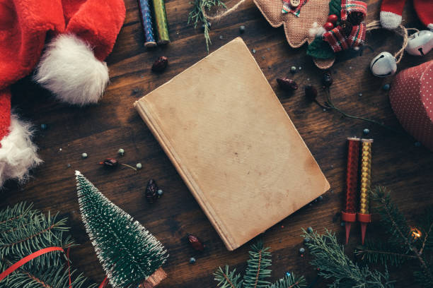 istock Vintage book among Christmas decoration, flat lay top view 1073985122