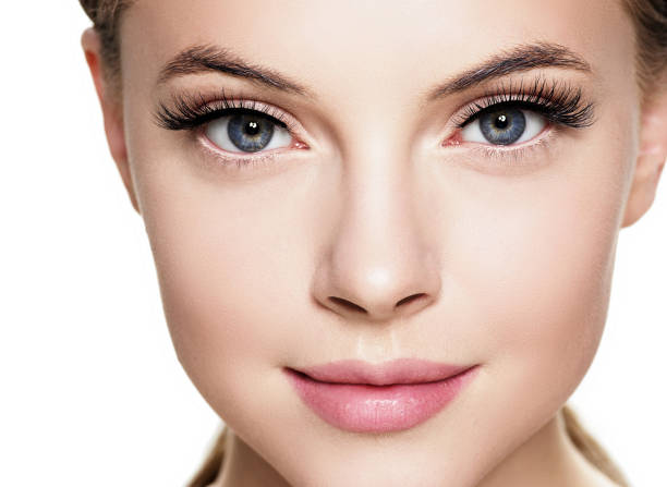 Beautiful woman face with eyelashes beauty healthy skin natural makeup. Beautiful woman face with eyelashes beauty healthy skin natural makeup. Studio shot. eyelash stock pictures, royalty-free photos & images