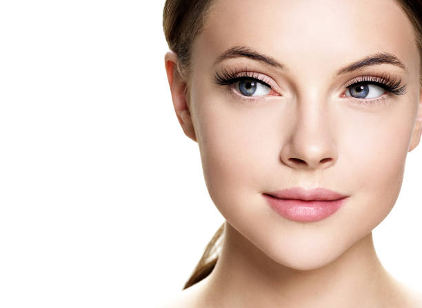 Beautiful woman face with eyelashes beauty healthy skin natural makeup. Beautiful woman face with eyelashes beauty healthy skin natural makeup. Studio shot. false lashes stock pictures, royalty-free photos & images