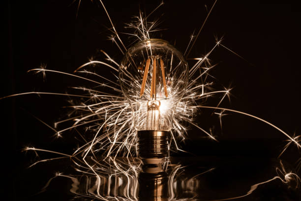 istock Fireworks sparkler showing through LED light bulb 1073993212
