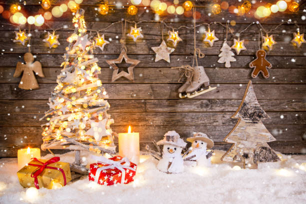 istock Christmas tree decoration on wooden background 1073993622