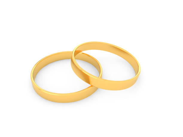 istock Gold wedding rings on a white background. 1073994914