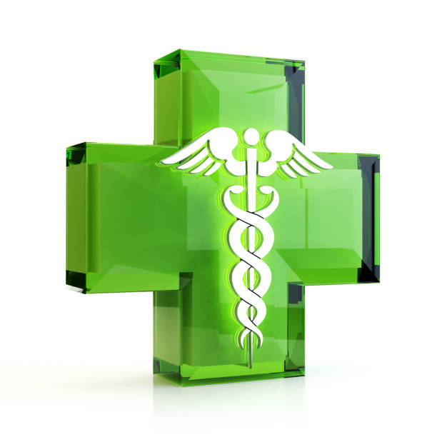 istock Green cross, two snakes and wings 1073995220