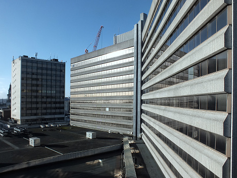 Leeds, Yorkshire, Great Britain - February 2015: the 1960s concrete facade of merrion house, a brutalist 1960s council office as it looked before extensive redevelopment into a modern complex