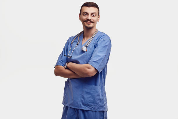 istock Handsome young arabic doctor with fancy mustache in blue 1074009692