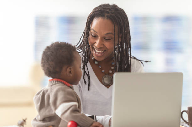 istock A mother works from home with her young son 1074014196