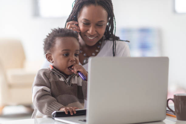 istock A mother works from home with her young son 1074014216