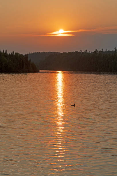 istock Sunset on a North Woods Lake 1074016294