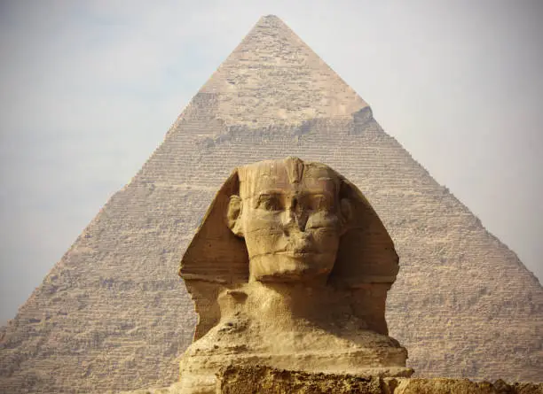 The Sphinx at Giza in Cairo set against the Pyramid  Pyramid of Khafre or of Chephren 

The Great Sphinx is among the world’s largest sculptures, measuring some 240 feet (73 metres) long and 66 feet (20 metres) high. It features a lion’s body and a human head adorned with a royal headdress.