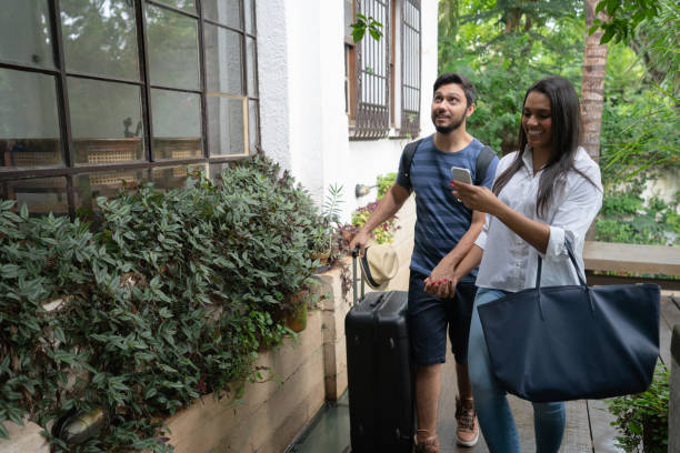 Young Couple Traveler Arrival at Accommodation - Bed and Breakfast or Hostel / Hotel