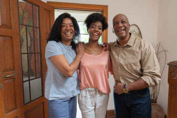 istock African Family Embracing at Home 1074025376