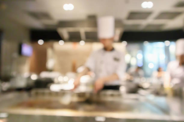 istock Chef cooking in restaurant kitchen blurred defocused background 1074030172