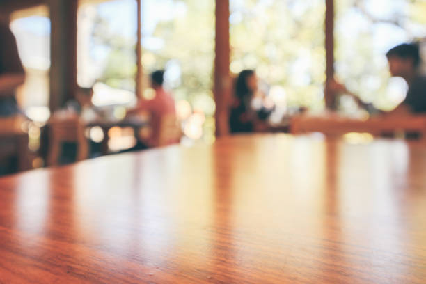 istock Restaurant cafe or coffee shop interior with customer blur abstract vintage style bokeh light for montage product display background 1074030176