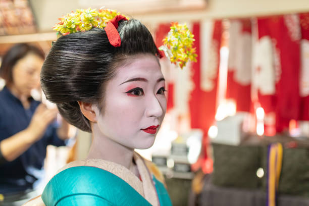 istock Maiko Apprentice Geisha making up in fitting room 1074030252