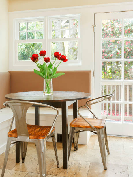 Breakfast Nook Sun filled breakfast nook with booth and two chairs breakfast room stock pictures, royalty-free photos & images