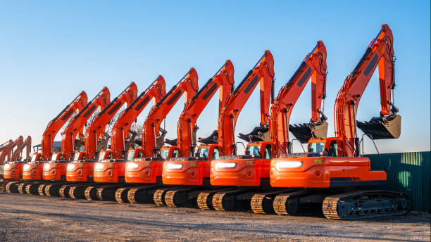istock A complect of new excavators sold and parked 1074039248