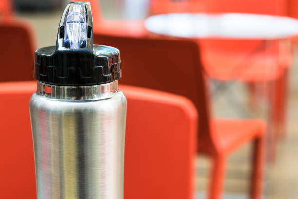 istock Iron thermos with black lid on defocused background. 1074041710
